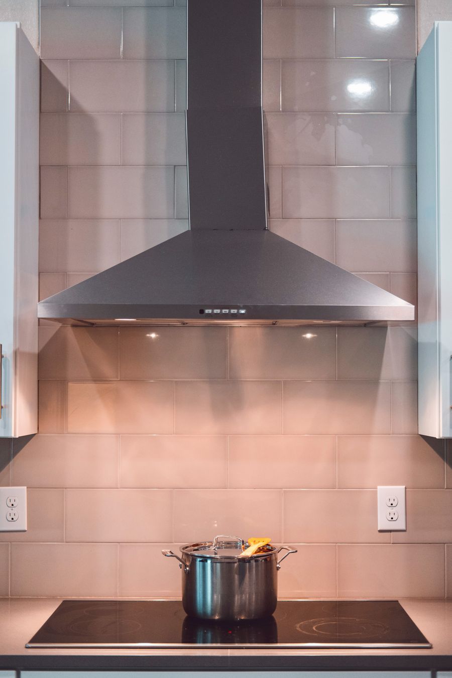 Range hood ventilation system installed over a kitchen stove