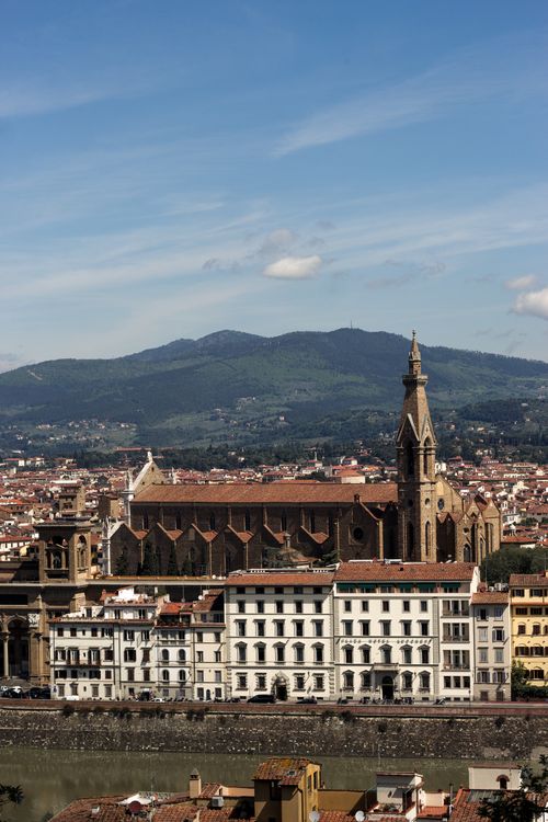 Free Aerial view of Florence featuring the Santa Croce Basilica against Tuscany's rolling hills. Stock Photo