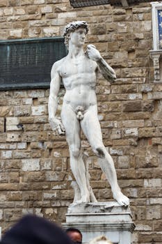 Iconic sculpture of David by Michelangelo, located in Florence, Italy.