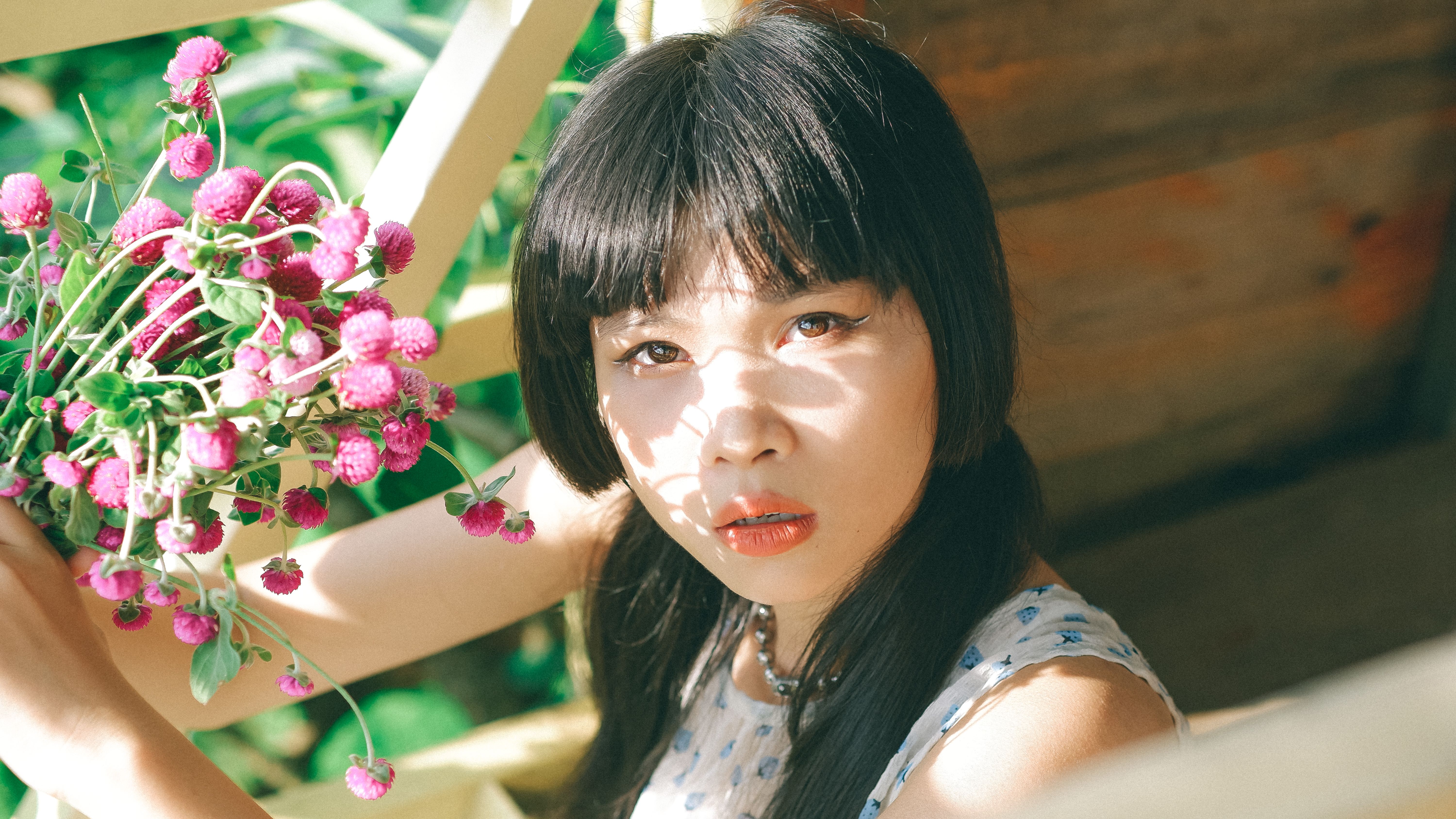 Woman Holding a Bunch of Flowers · Free Stock Photo
