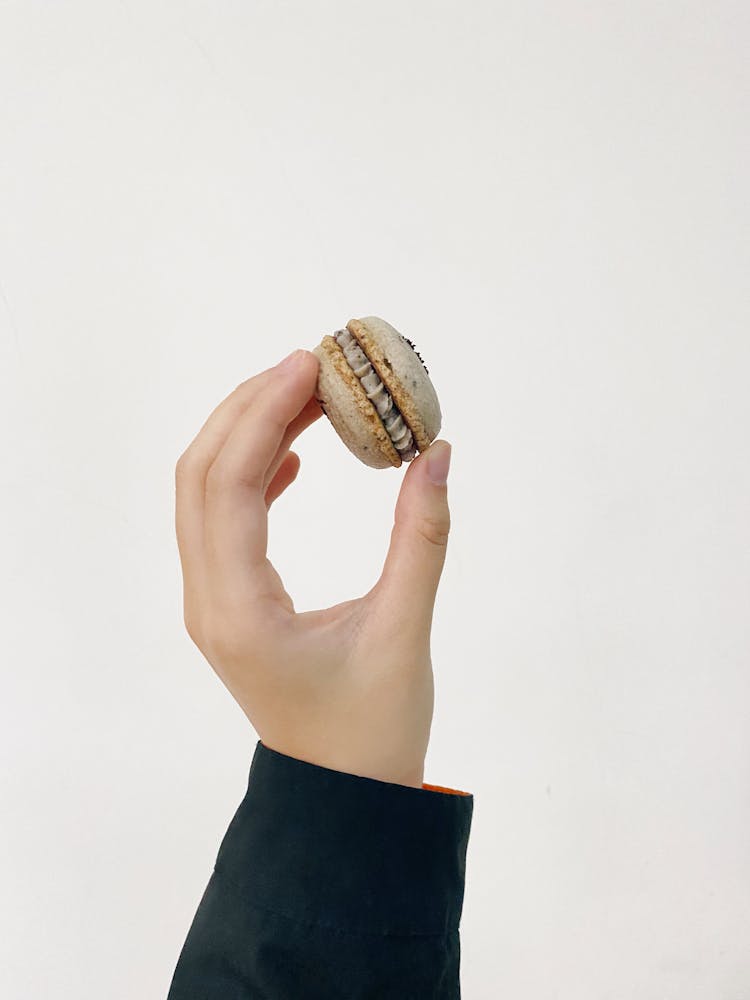 A Person Holding A Cookie