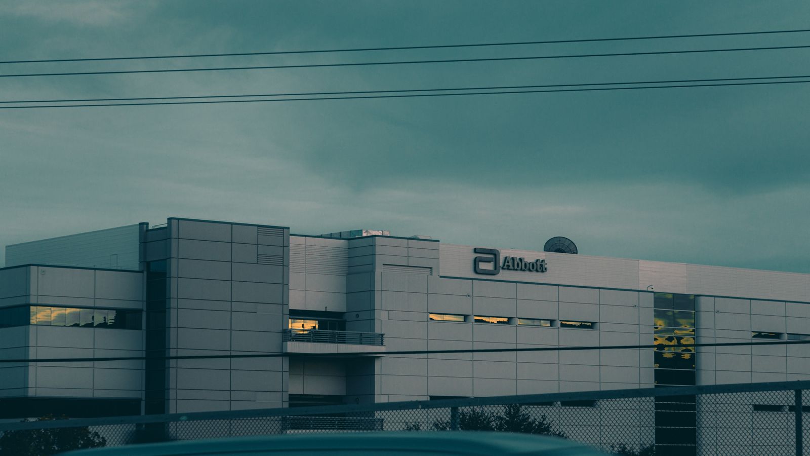 A modern building in Temecula, CA, under a gloomy sky, showcasing contemporary architecture.
