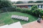 Long banquet table set on a lawn, by Alina Skazka on Pexels