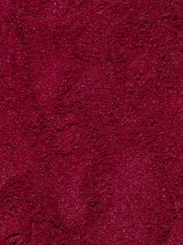 Rich red sand texture perfect for artistic backgrounds or design elements.