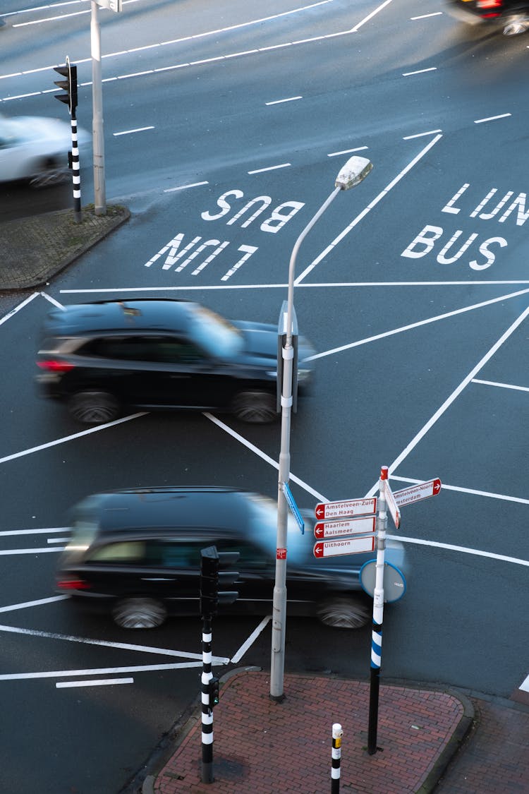 Black Cars Traveling On A Road