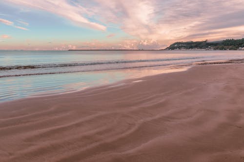 Sand Beach and Sea on Beautiful Sunset