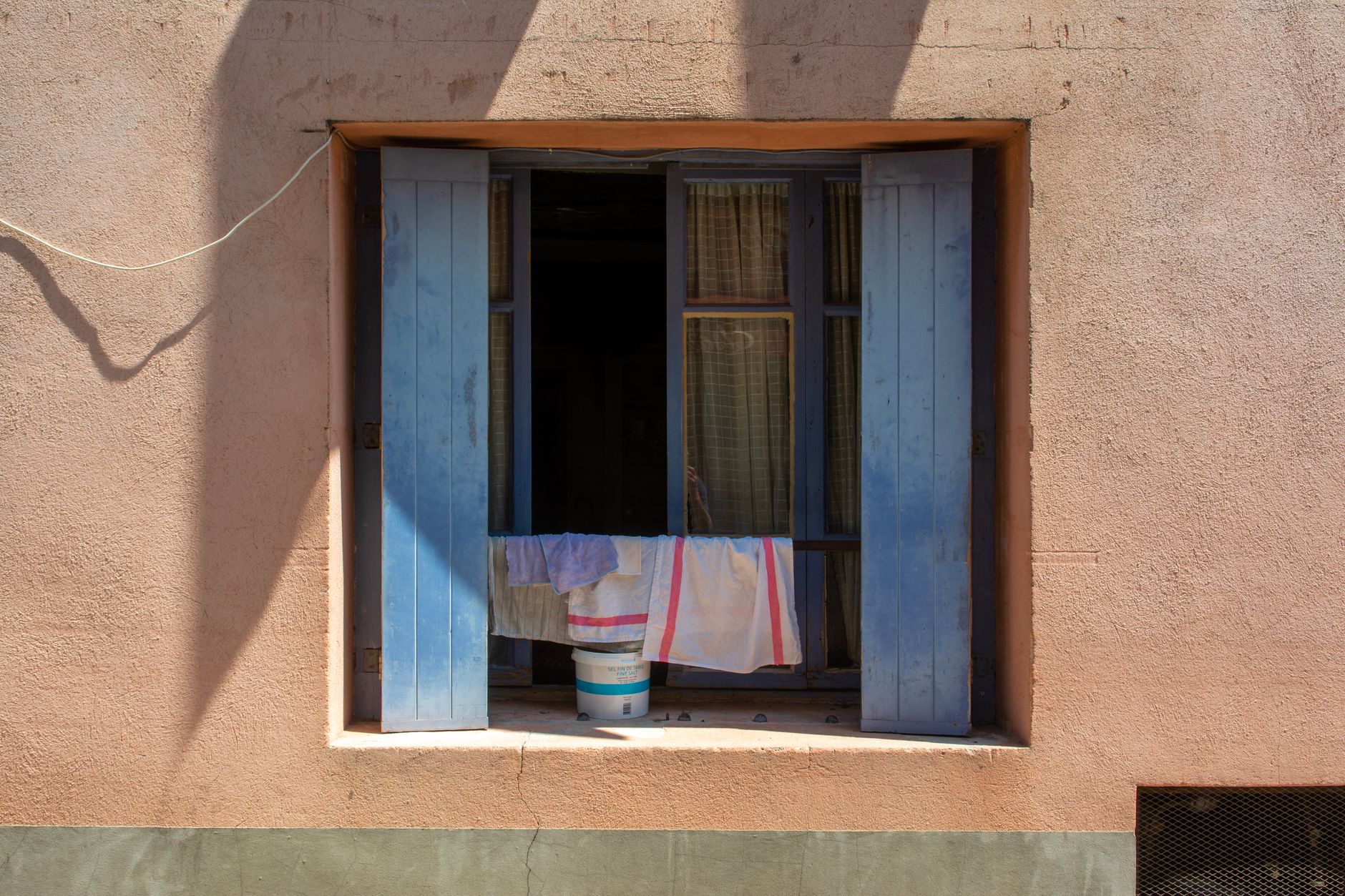 Cloths in a Window in Sunlight