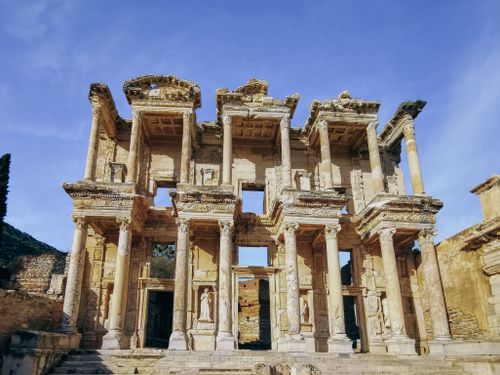 Free Explore the grandeur of ancient Roman architecture with impressive columns and clear sky. Stock Photo