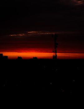 Capture of a breathtaking sunset over Buenos Aires, highlighting the silhouette of buildings and vibrant sky.