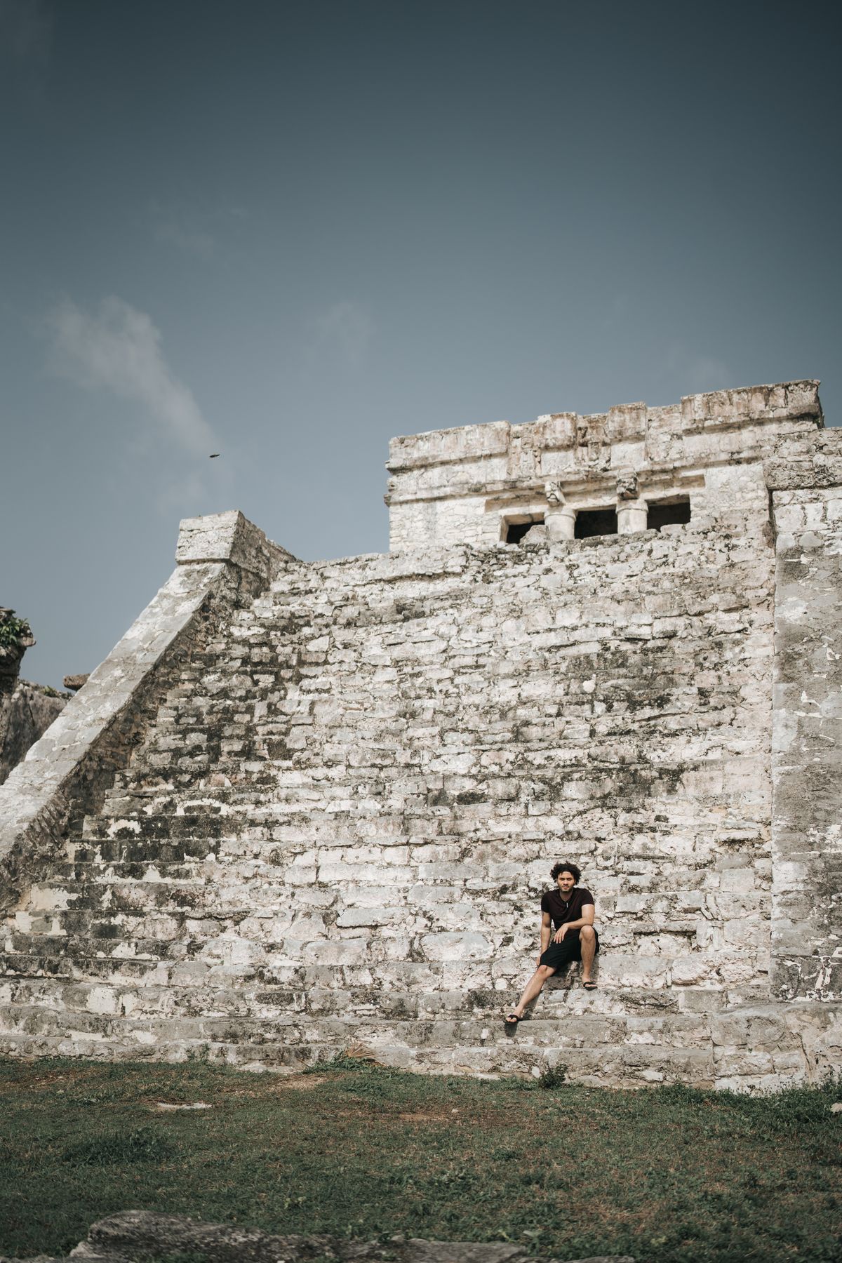 Traveler exploring ancient Mayan ruins in Mexico