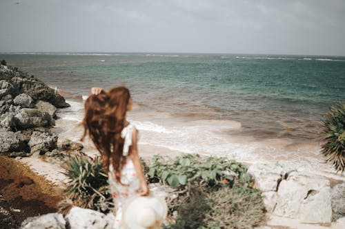 Woman with Hat on Sea Shore