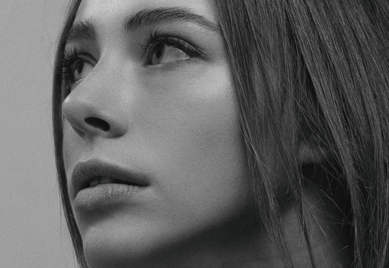 close up black and white portrait capturing a woman s timeless eleganc