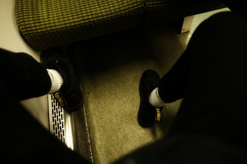 Foto profissional grátis de calçados, chuteiras, pernas