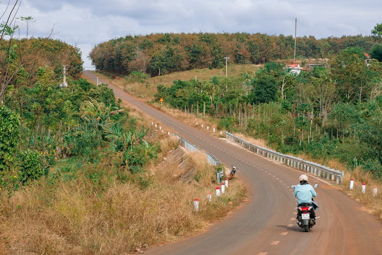 A Person Riding A Motorcycle On The Road