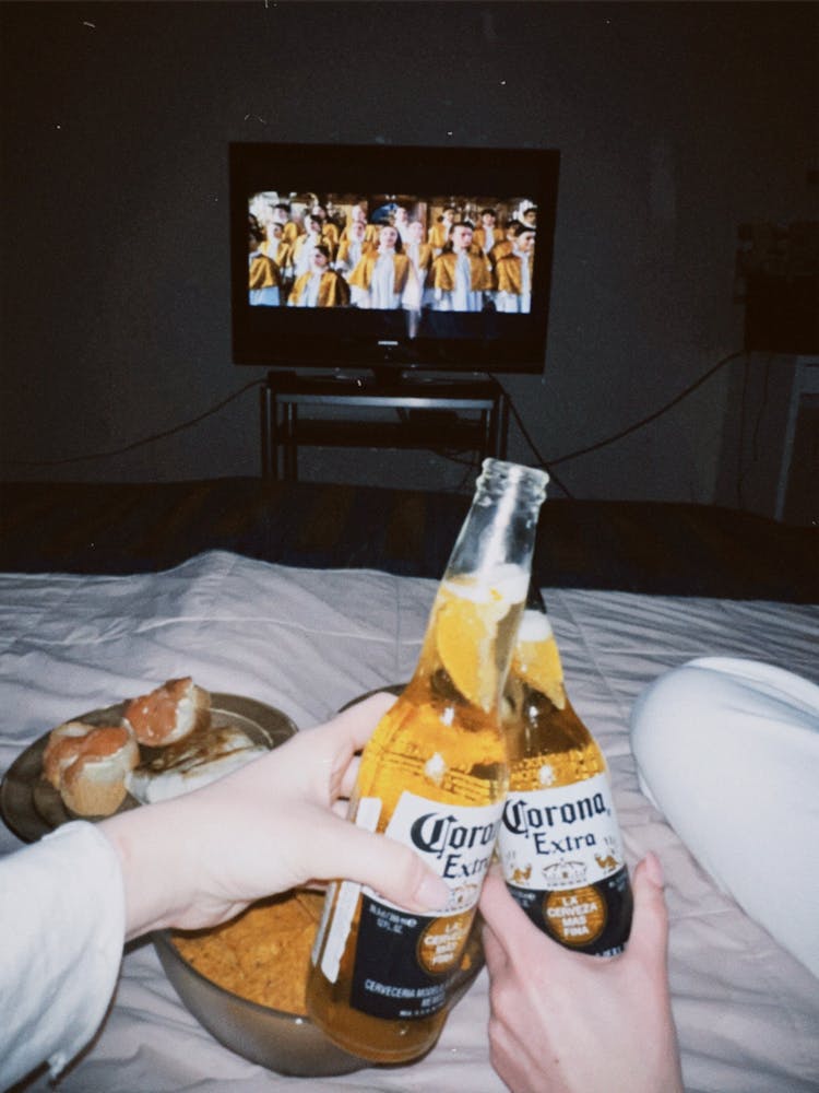 People Holding Beer Bottles 