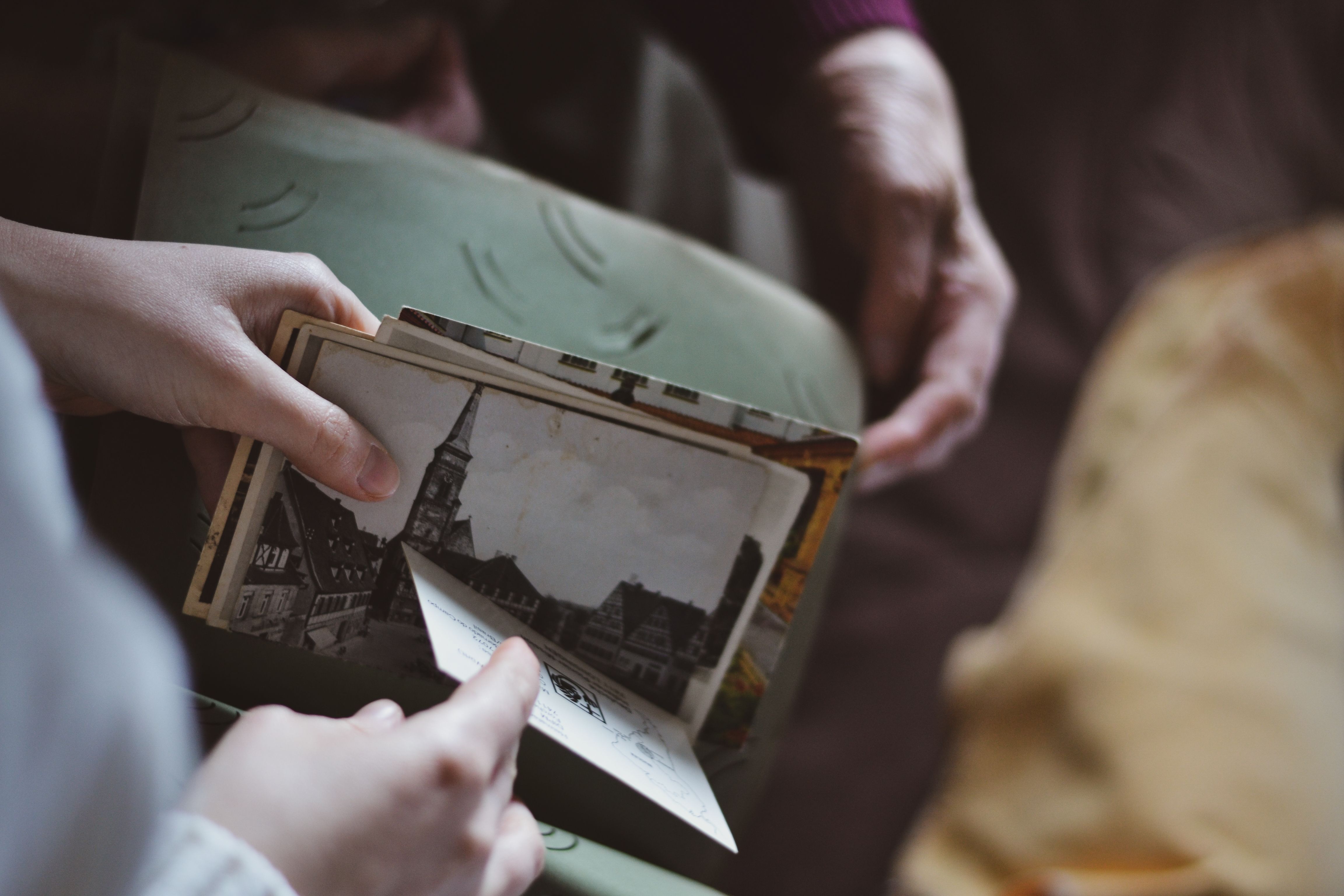 Woman Hands Holding Black and White Pictures · Free Stock Photo