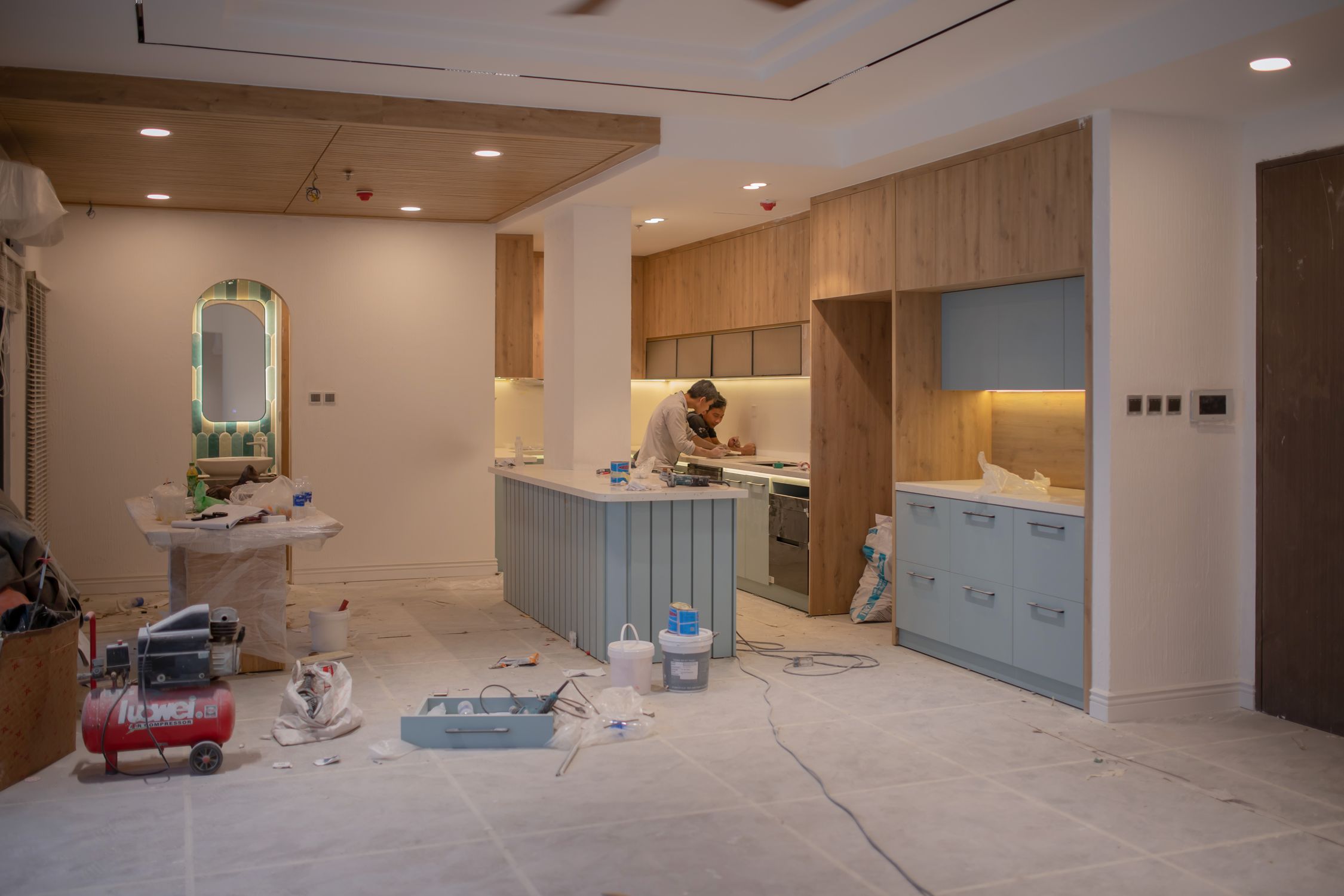 Workers inside a home during a major kitchen renovation project