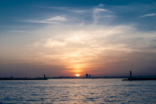 Free Beautiful sunset scene over the Bosphorus in İstanbul, featuring a silhouette of lighthouses against a stunning sky. Stock Photo