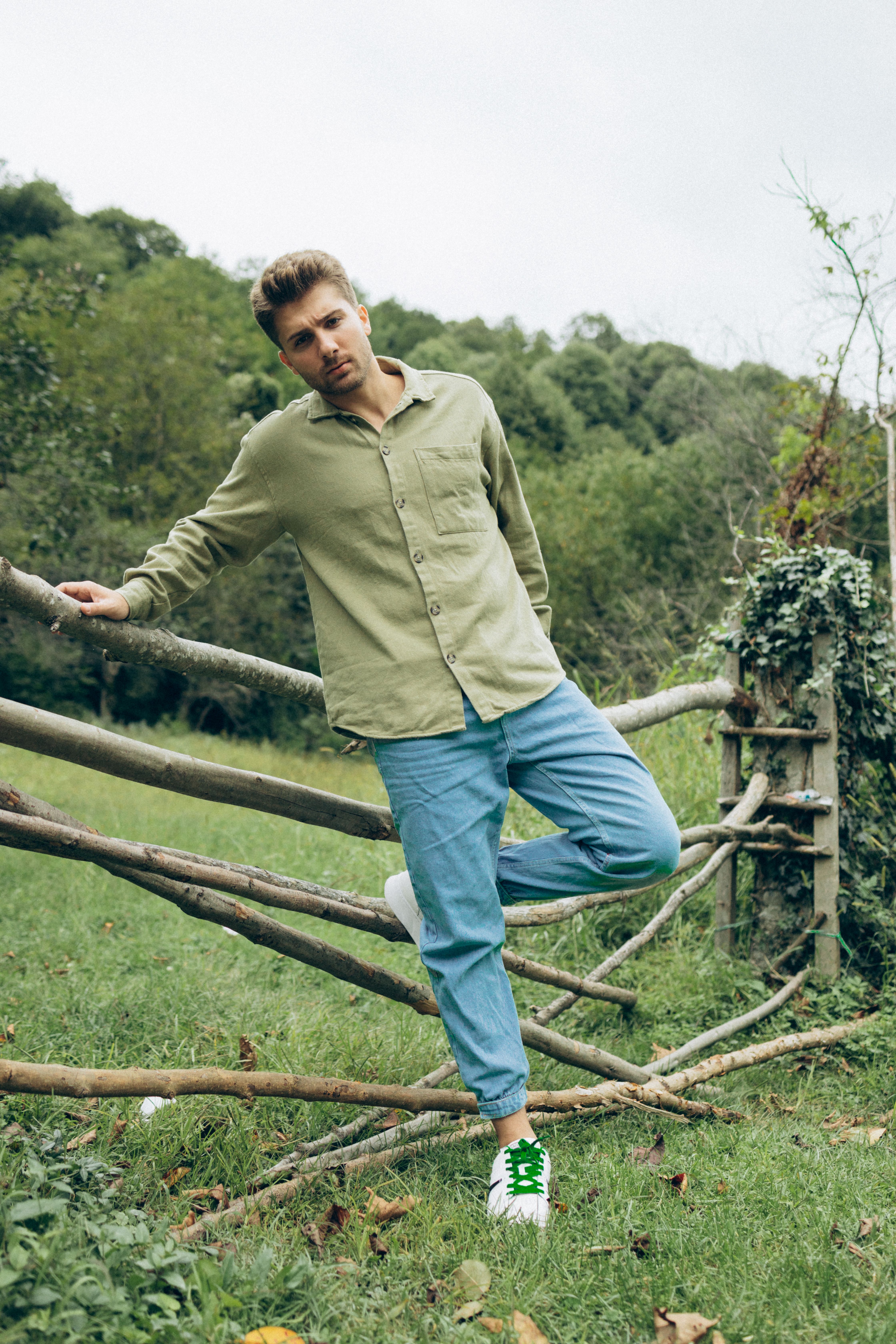 Young Man Standing on a Rural Field · Free Stock Photo
