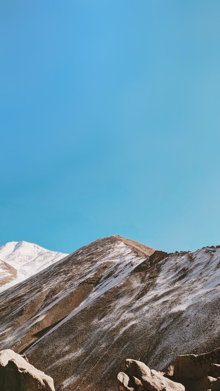 Clear Sky Over Mountains Peaks