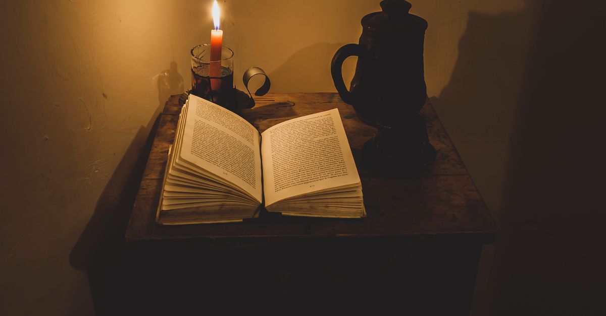 phone face down on table bible open candle quiet evening unplugged