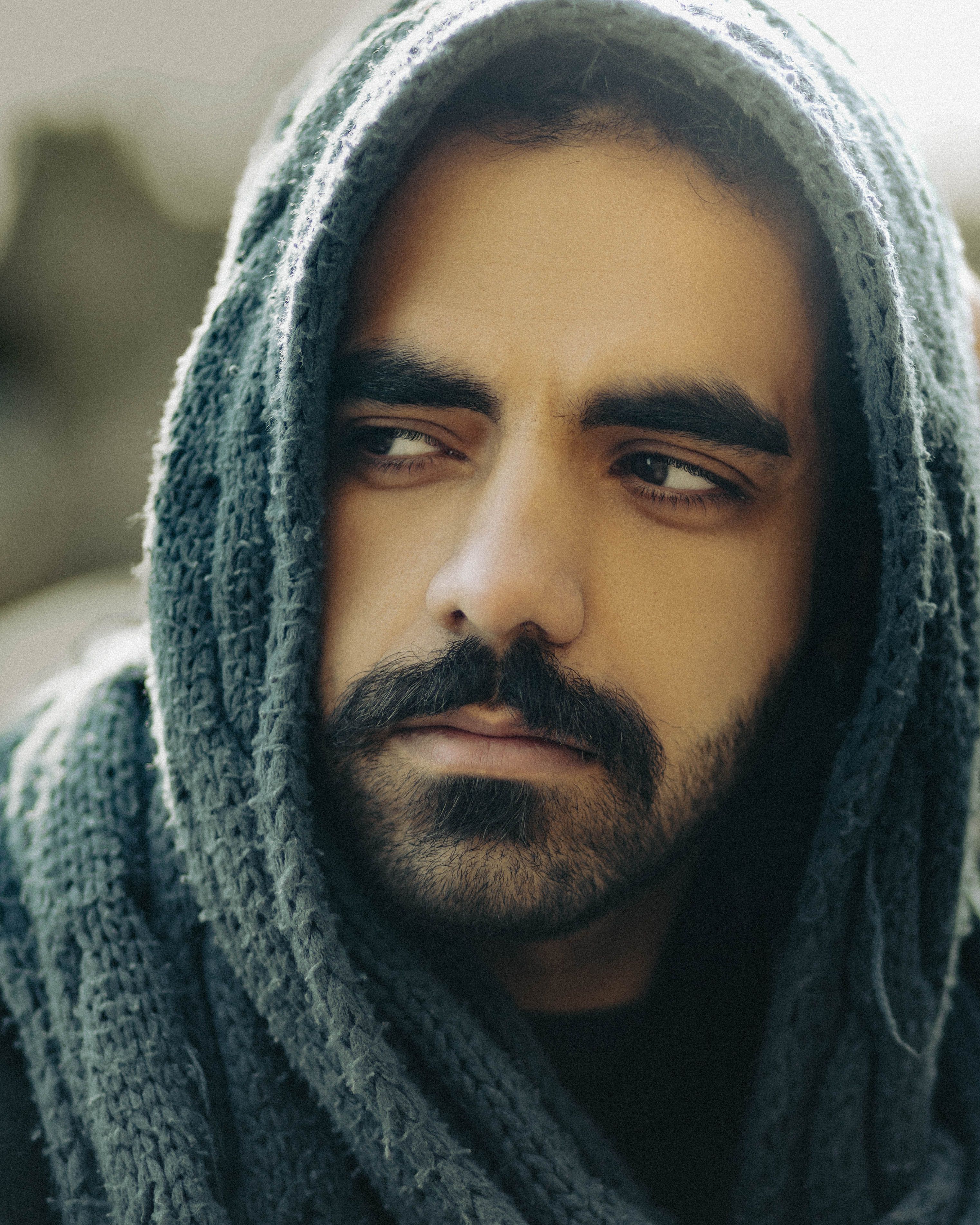 A Man Wearing Headscarf while Looking Afar