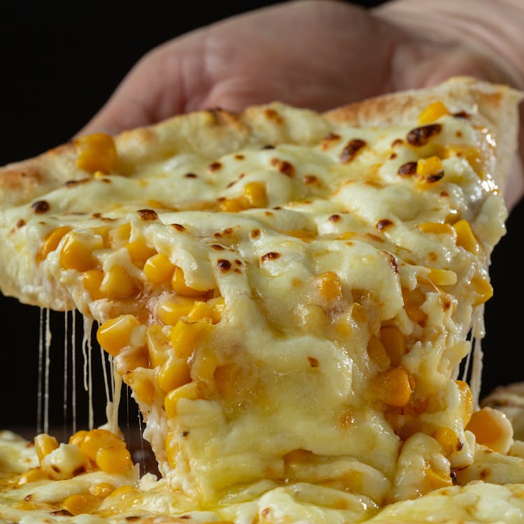 A Slice Of Cheesy Pizza 