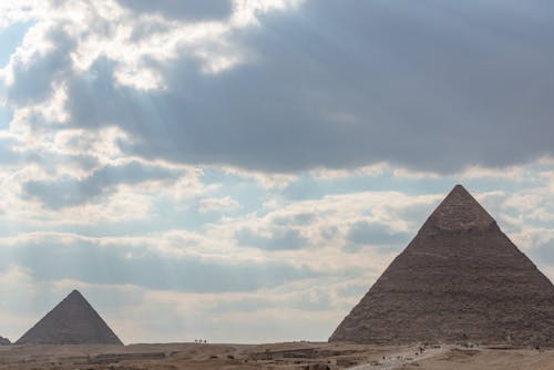 View of the Great Pyramid of Giza Under Cloudy Sky