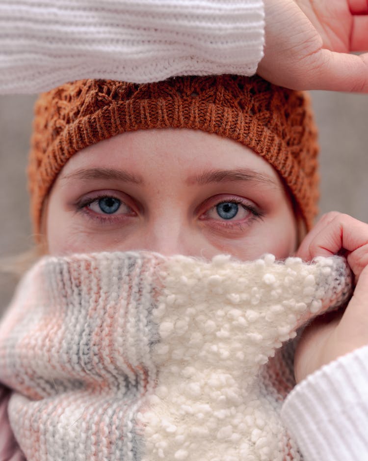 Woman Covering Face With Scarf