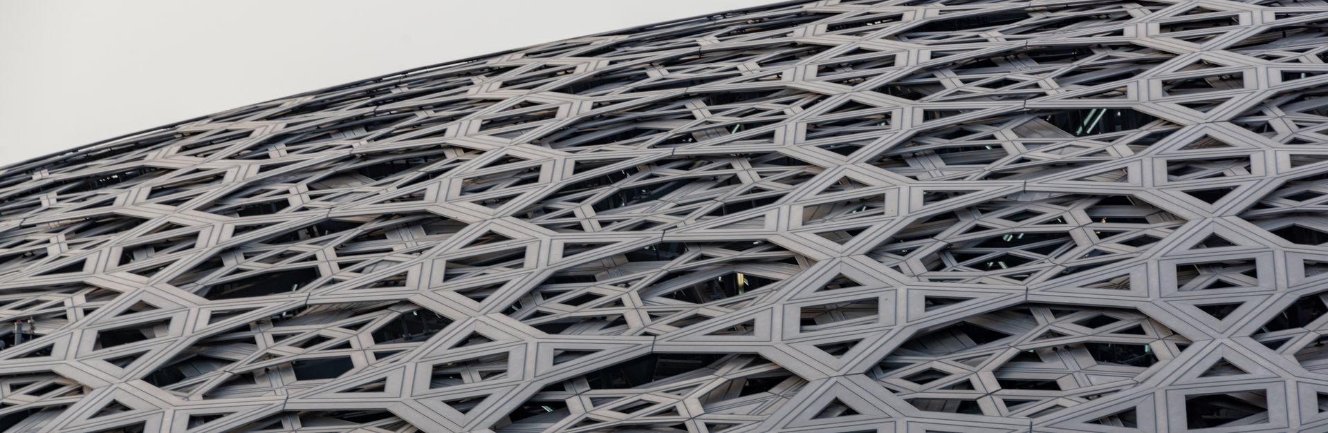 Louvre Abu Dhabi's geometric roof showcases modern architectural elegance.