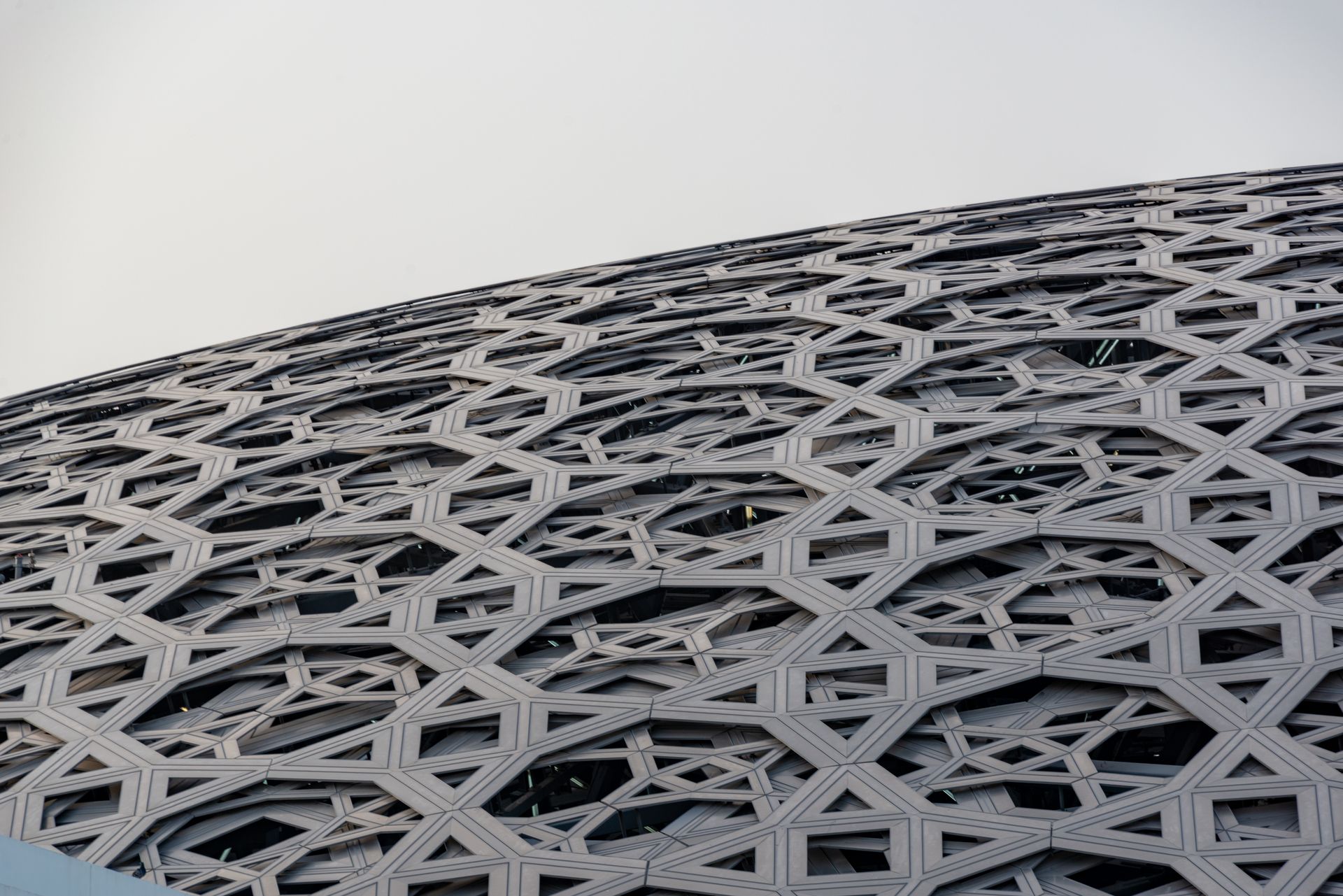 Louvre Abu Dhabi's geometric roof showcases modern architectural elegance.