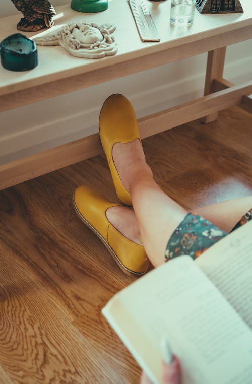 Woman Legs on Floor and with Book