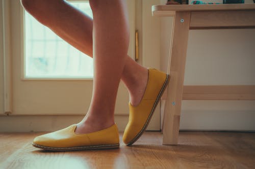 Woman Legs in Shoes on Floor