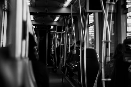 Free Atmospheric black and white shot of a bus interior in Rotterdam, highlighting urban public transportation. Stock Photo