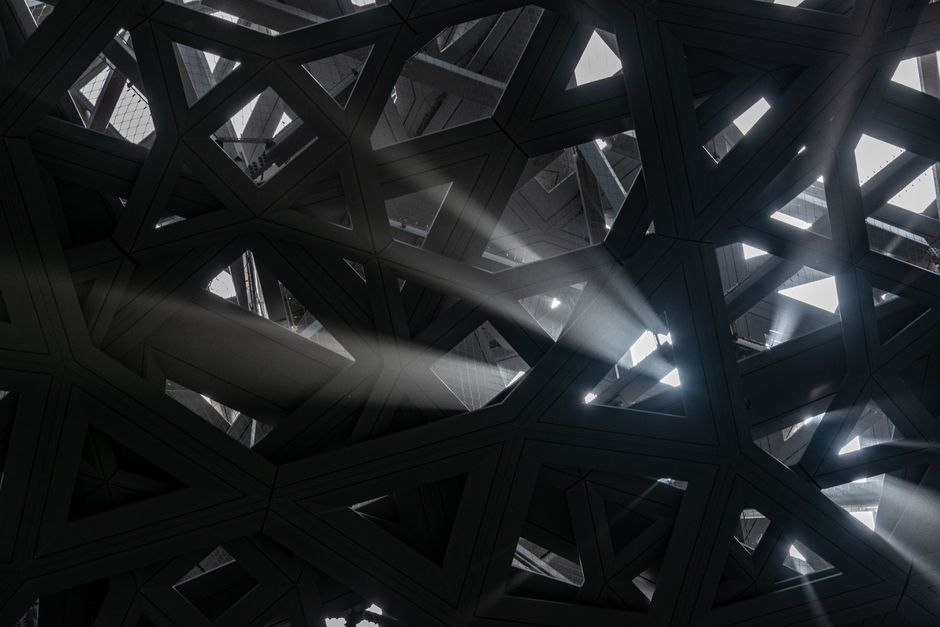 Sunlight streaming through a complex geometric structure casting dynamic shadows. Sunlight streaming through a complex geometric structure casting dynamic shadows.