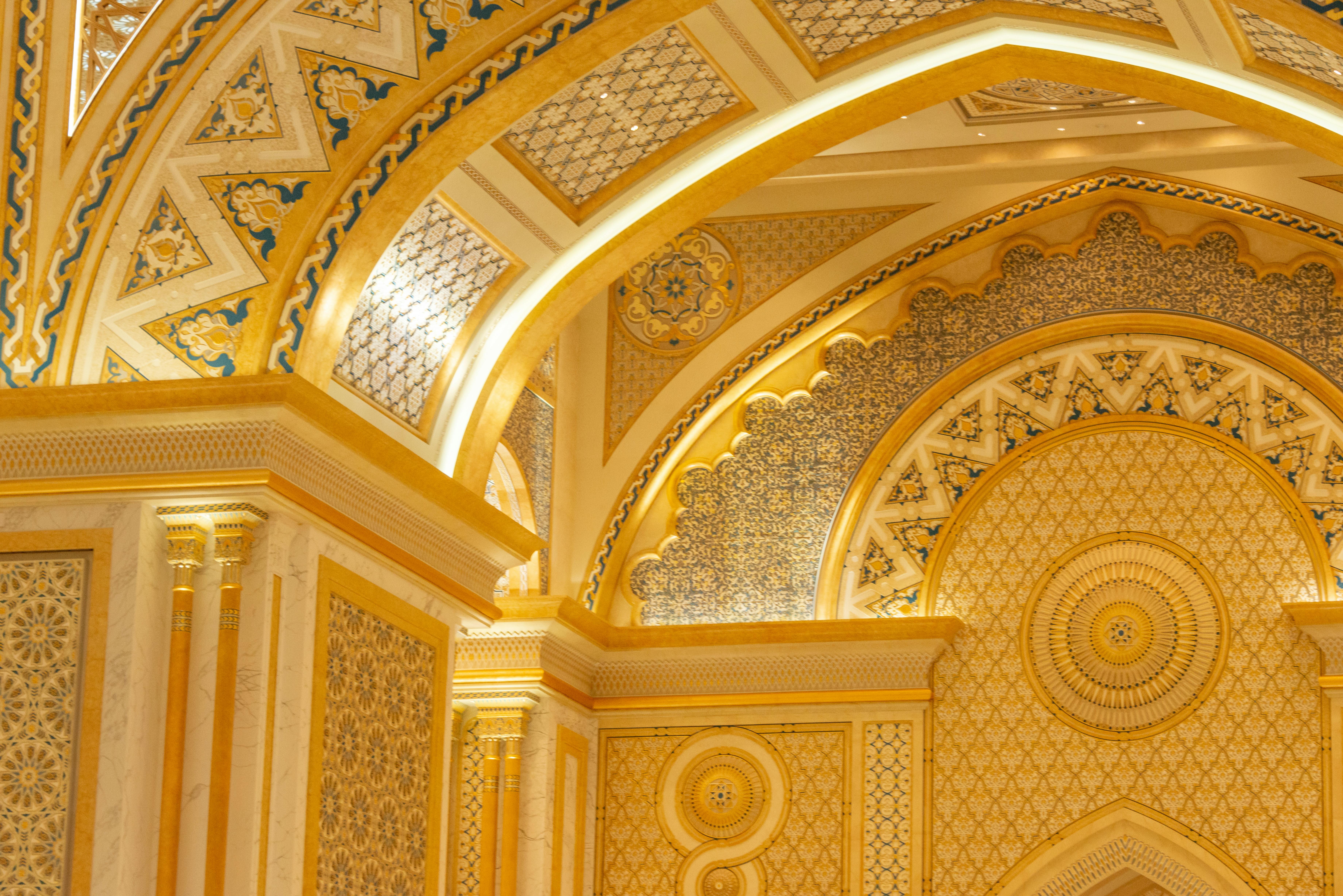 Luxurious palace interior featuring golden ornate decoration and intricate architectural details.