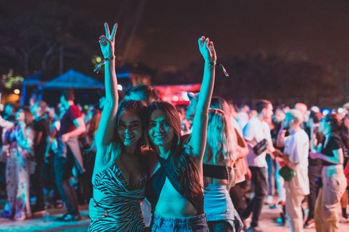 Free Capture the energy of a lively outdoor concert in Medellín at night with a vibrant crowd. Stock Photo