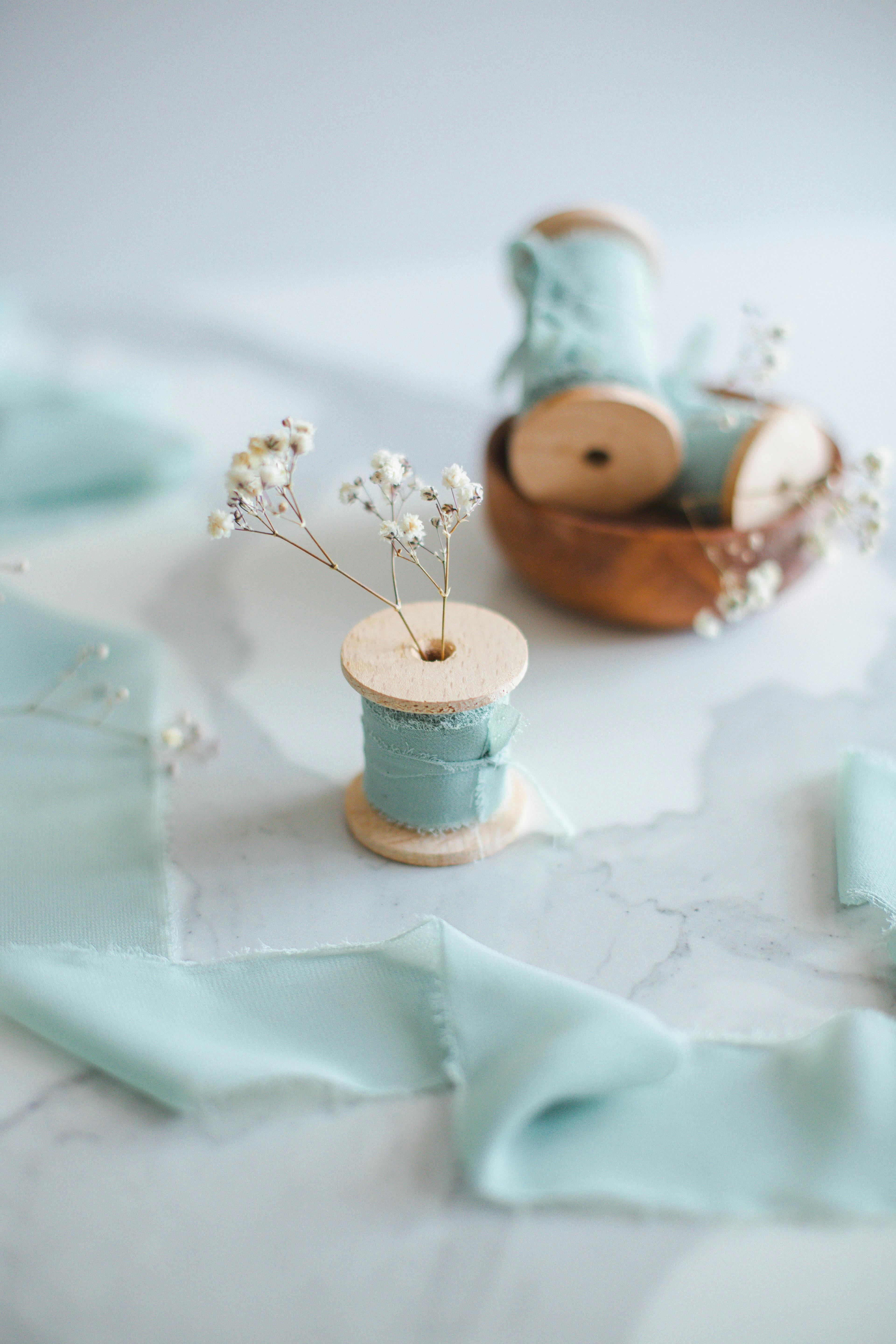 A spool of thread and a spool of thread on a marble table · Free Stock ...