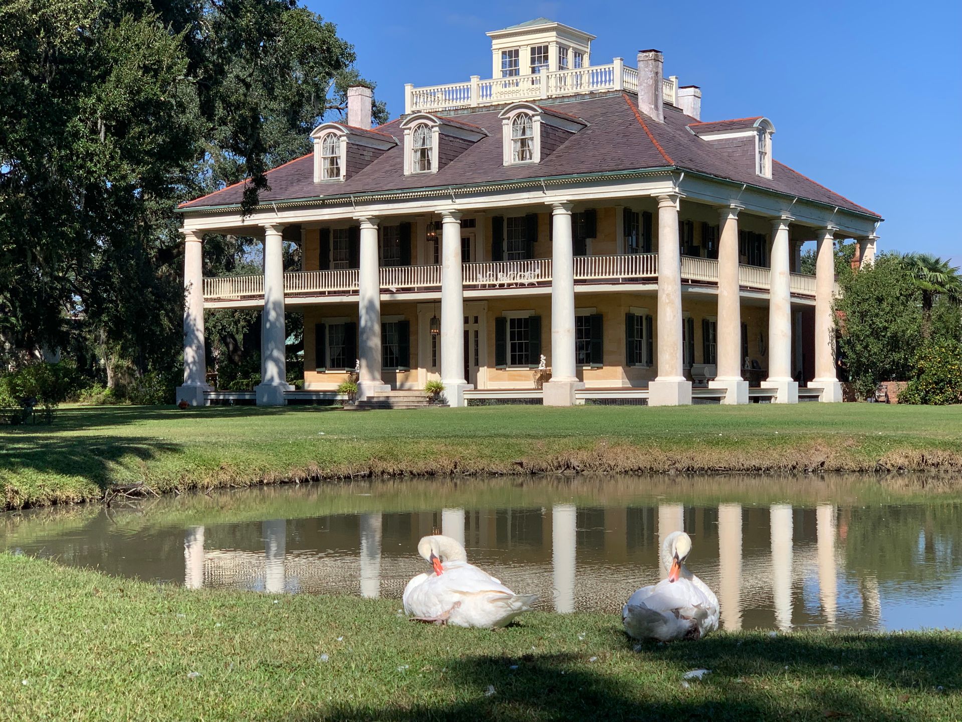 Mansion Reflecting in Pond