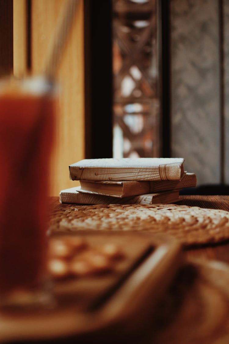 A Stack Of Books On A Table