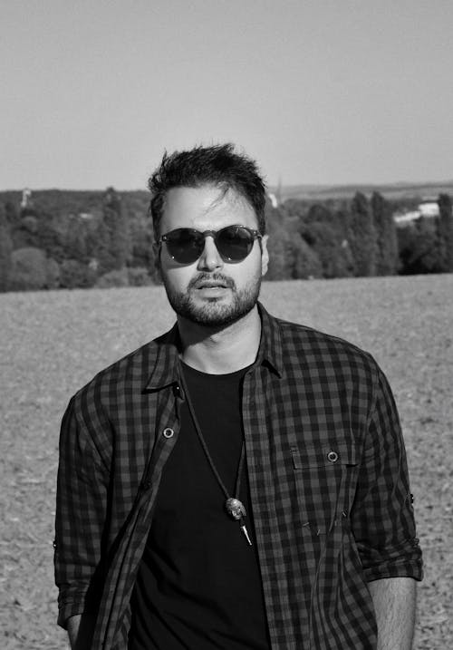 Grayscale Photo of Bearded Man Wearing Sunglasses