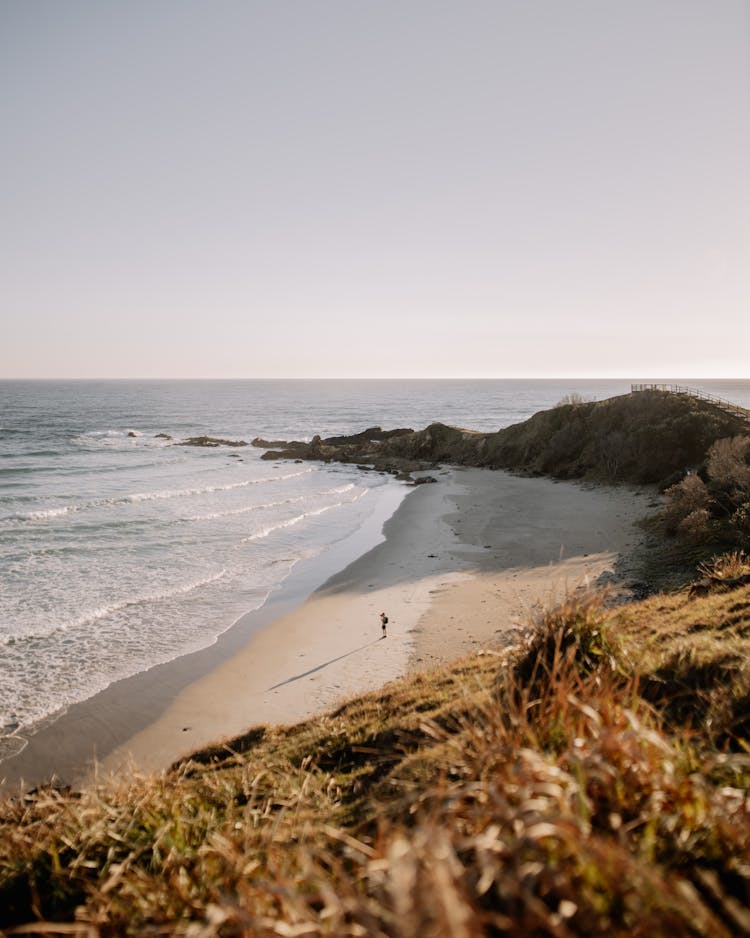 Person On Shore Of Byron Bay In Australia