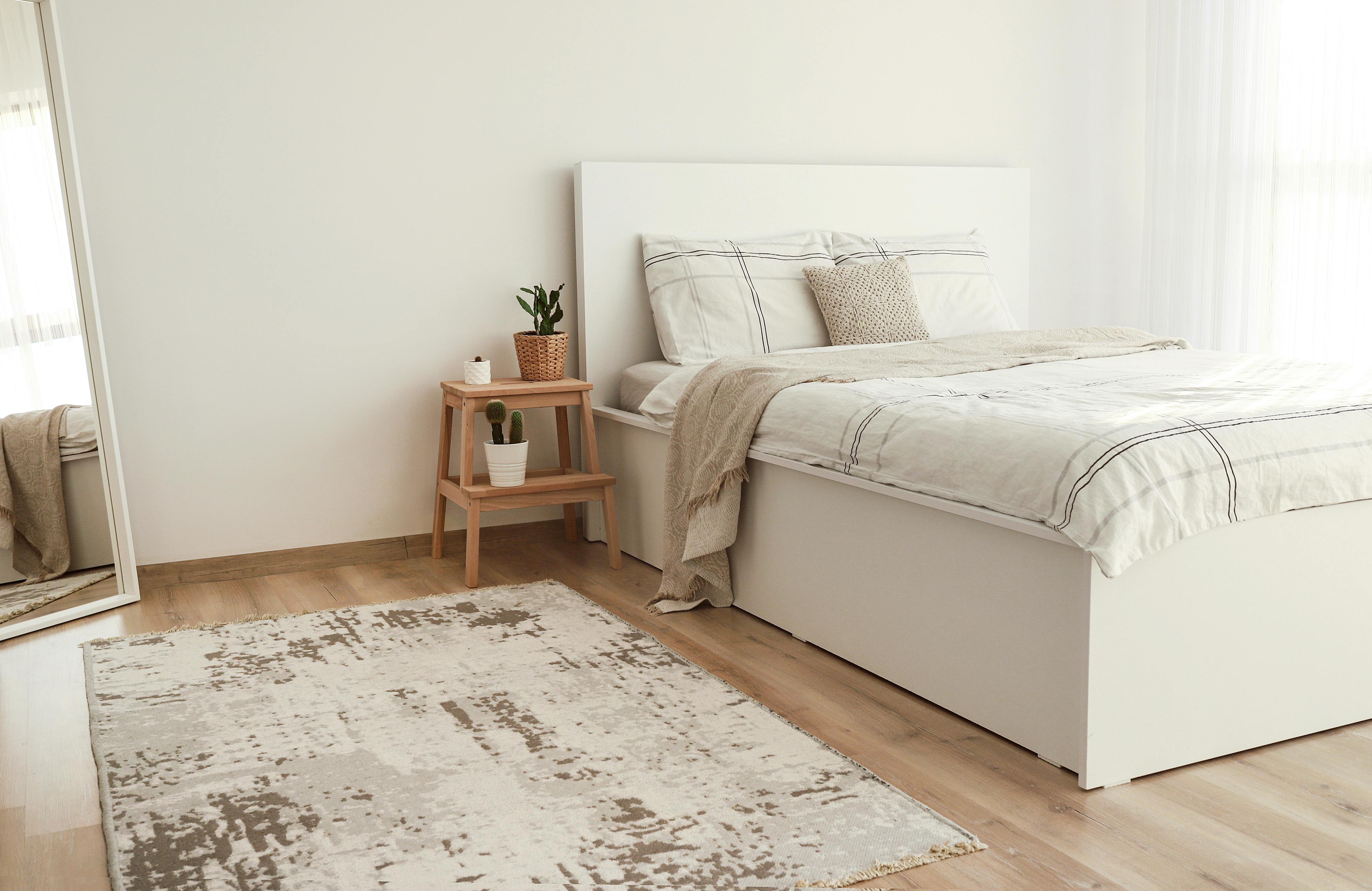 Free Bright Scandinavian style bedroom with minimalist decor and neutral tones. Stock Photo