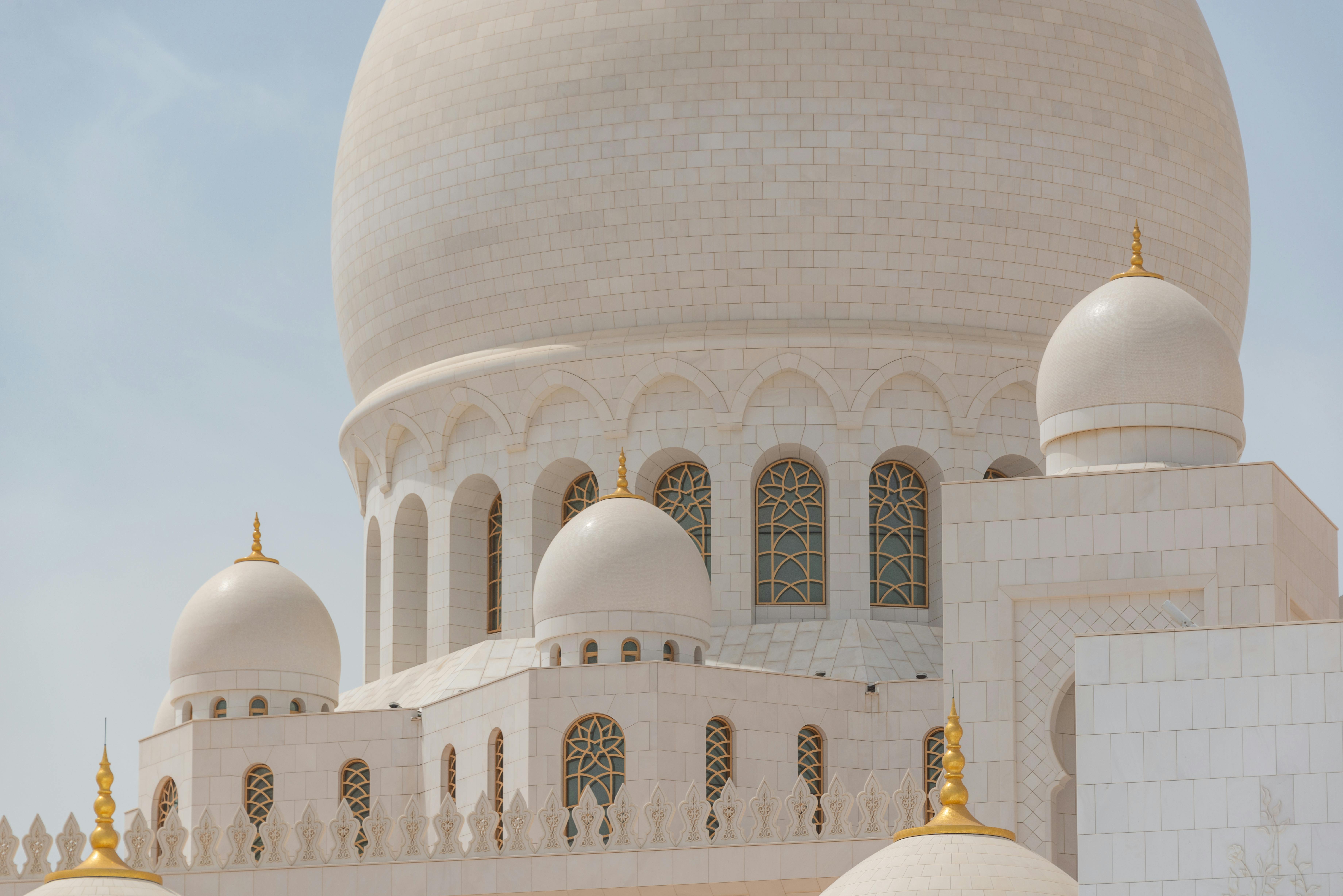Close-up view of domes at the Sheikh Zayed Grand Mosque in Abu Dhabi, showcasing intricate architecture.