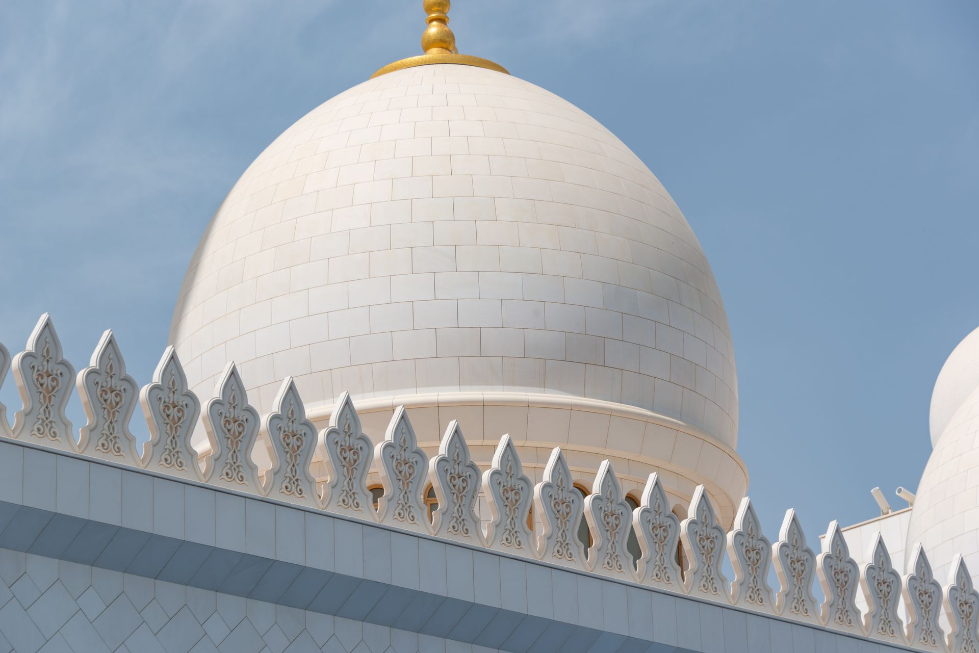 Close-up of the Sheikh Zayed Grand Mosque dome showcasing intricate Islamic architecture in UAE.