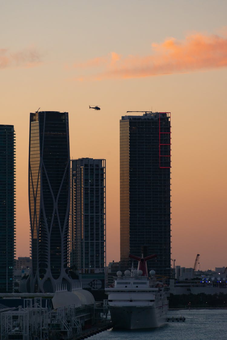 Skyscrapers On Waterfront City Bank On Sunset