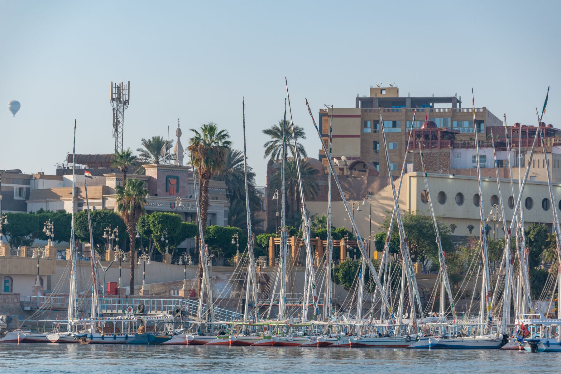 The Nile at Luxor with the East Bank Corniche and the West Bank Theban hills beyond