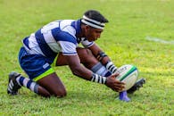 Man Preparing Ball at Rugby Game