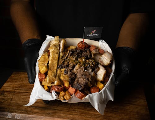 Holding a Box of Fried Meats 