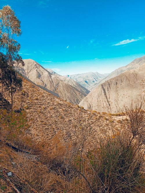 Free Breathtaking view of barren mountain terrain under a clear blue sky in Apurimac, Peru. Stock Photo
